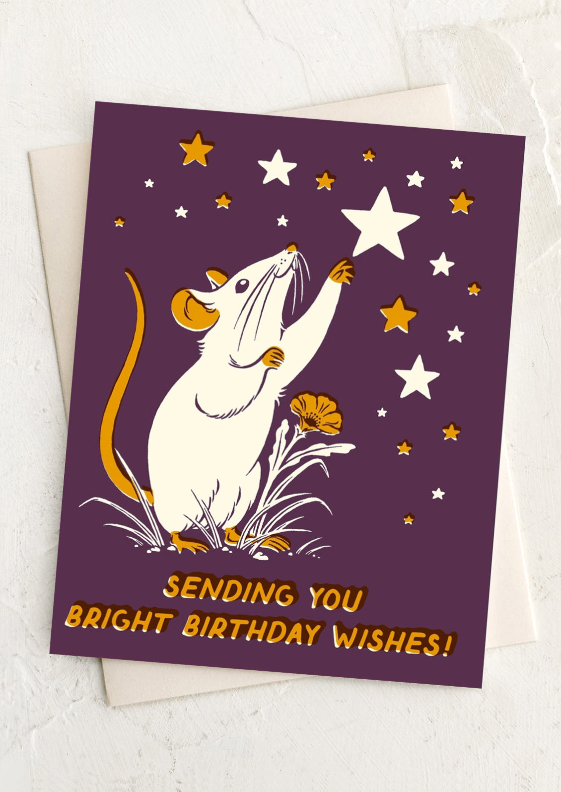 Greeting card with a mouse reaching for stars and text 'Sending you bright birthday wishes!' on a purple background.