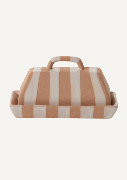 A rectangular, modern looking ceramic butter dish with white and sand stripe pattern.