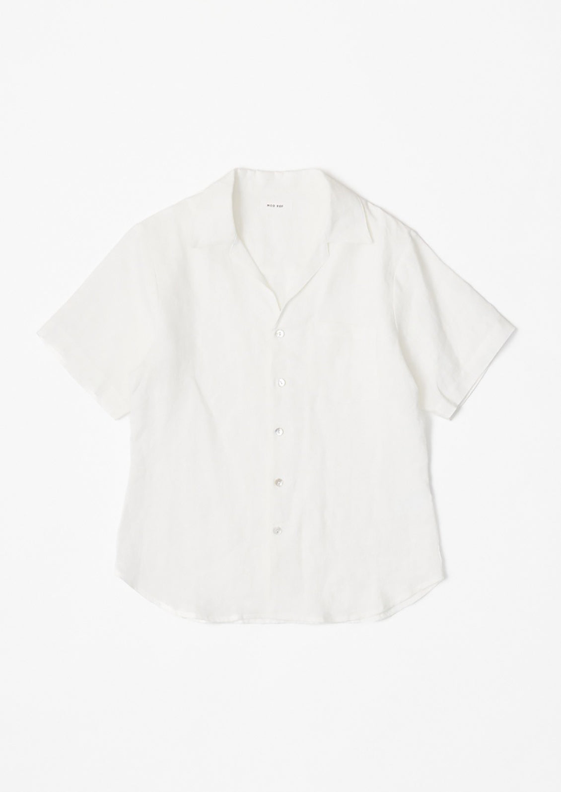 A white linen shortsleeved button-up.