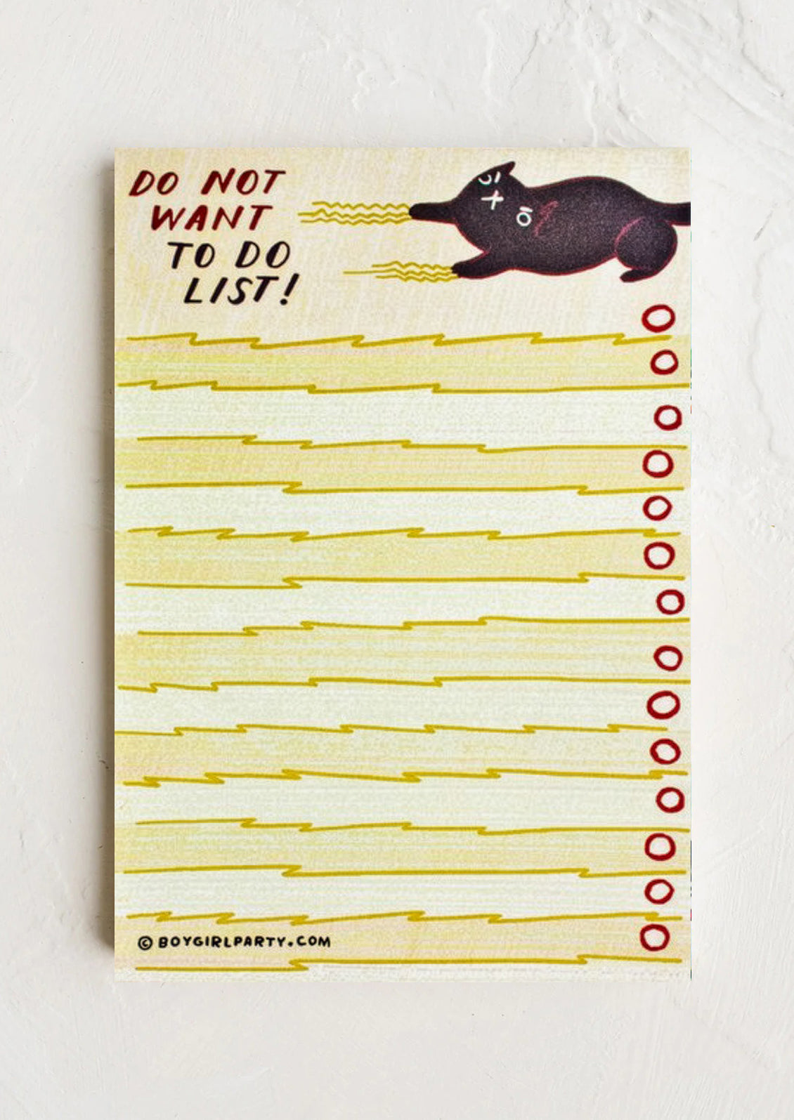 Notepad with 'Do Not Want To Do List' text and a cat illustration on a white background