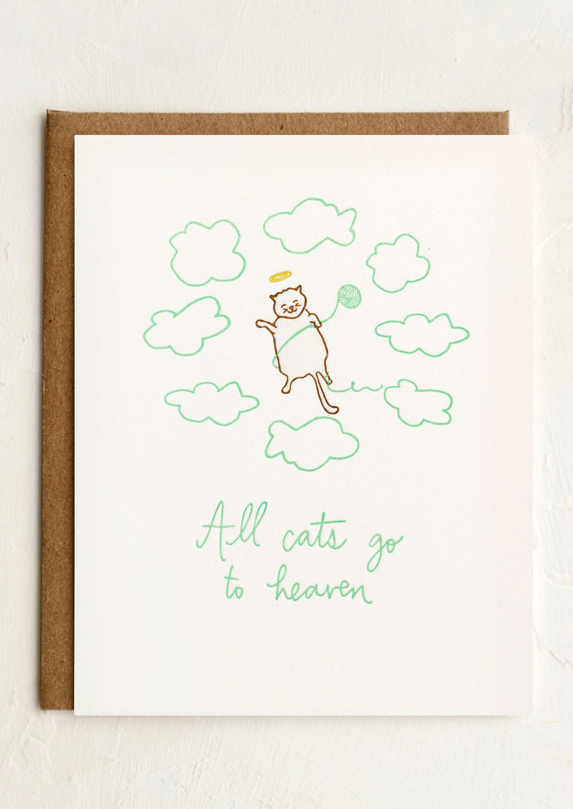 A card reading "All cats go to heaven".