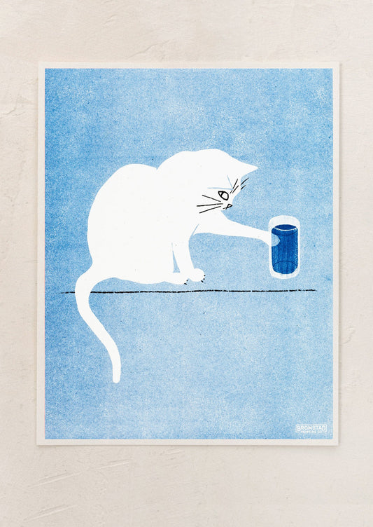 A risograph art print depicting a white cat with water glass atop blue background.
