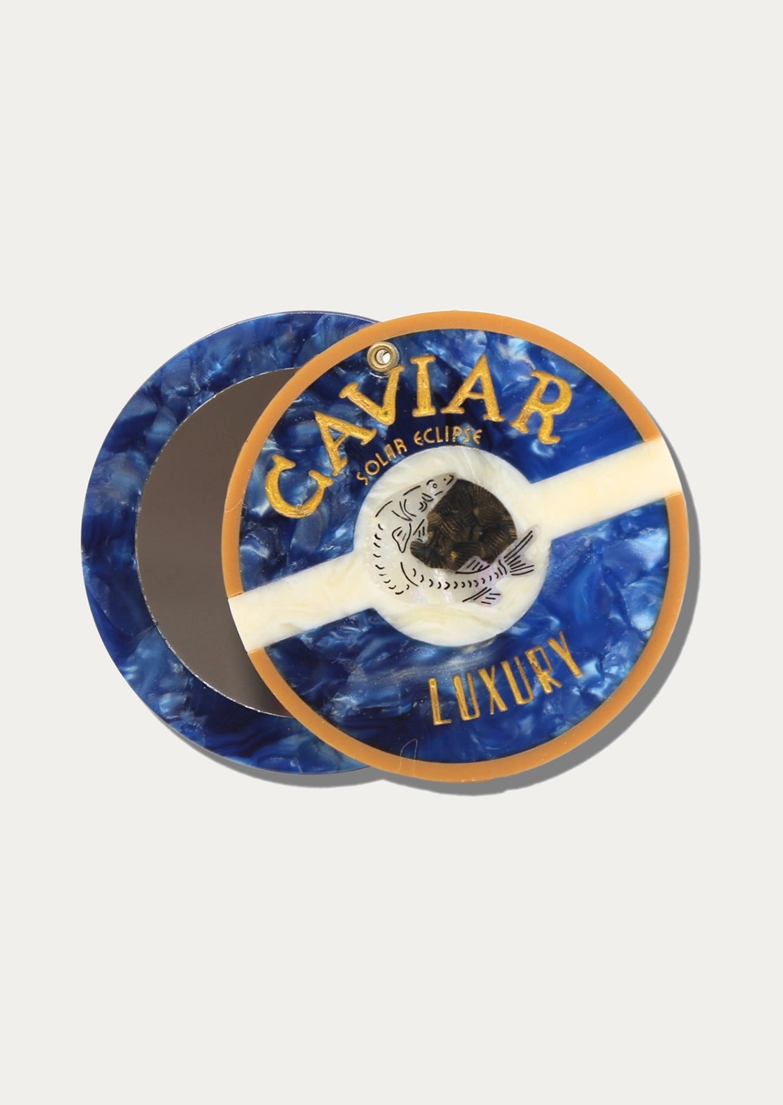 A compact mirror depicting caviar.