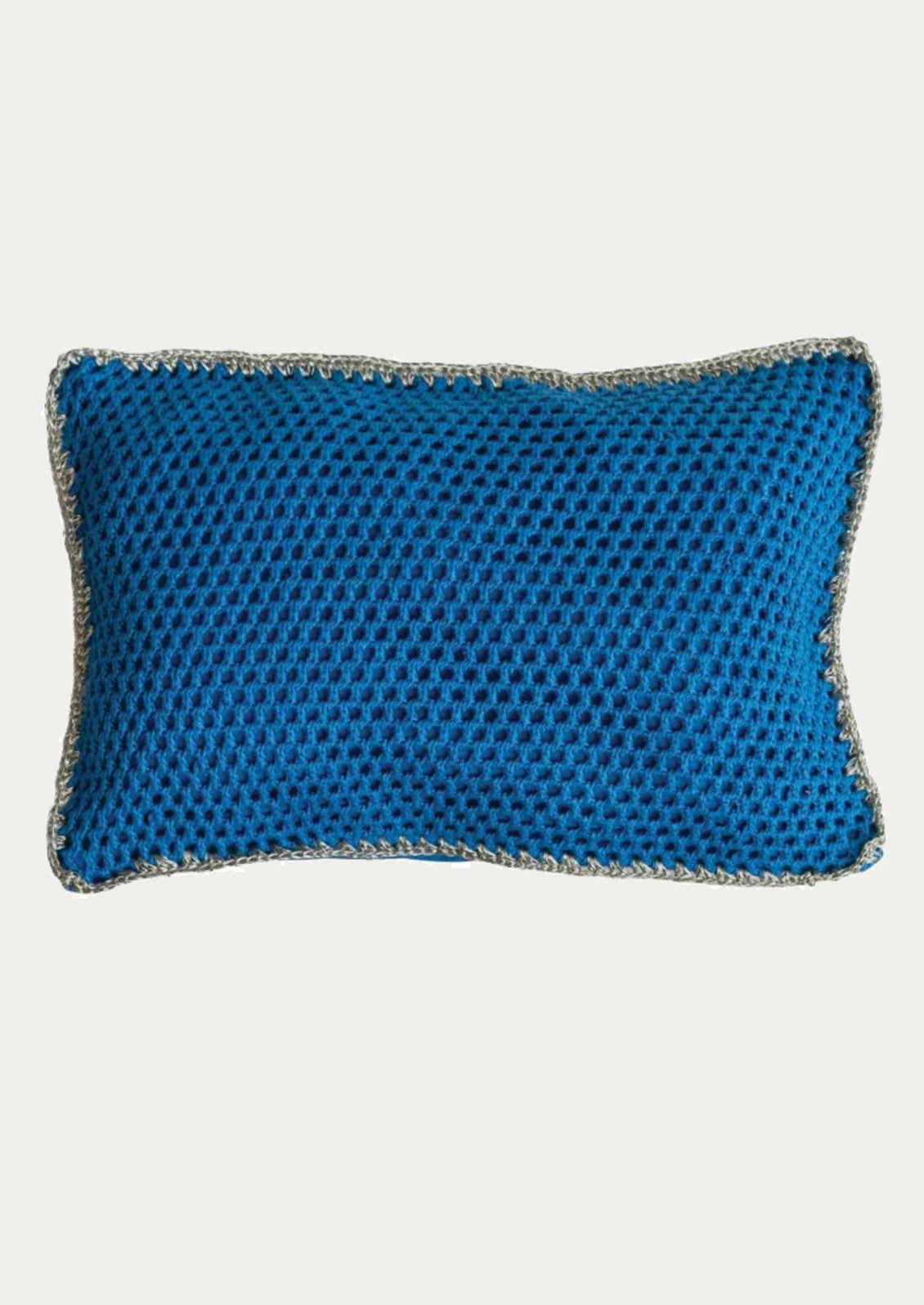 Blue textured pillow with a white background