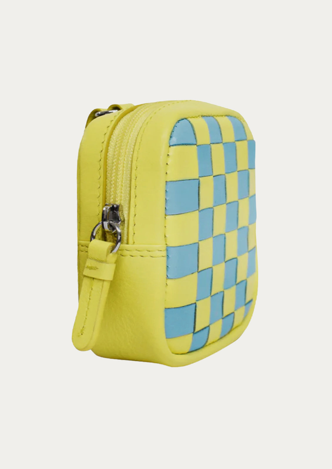 A yellow and turquoise leather coin pouch with a checkerboard pattern.