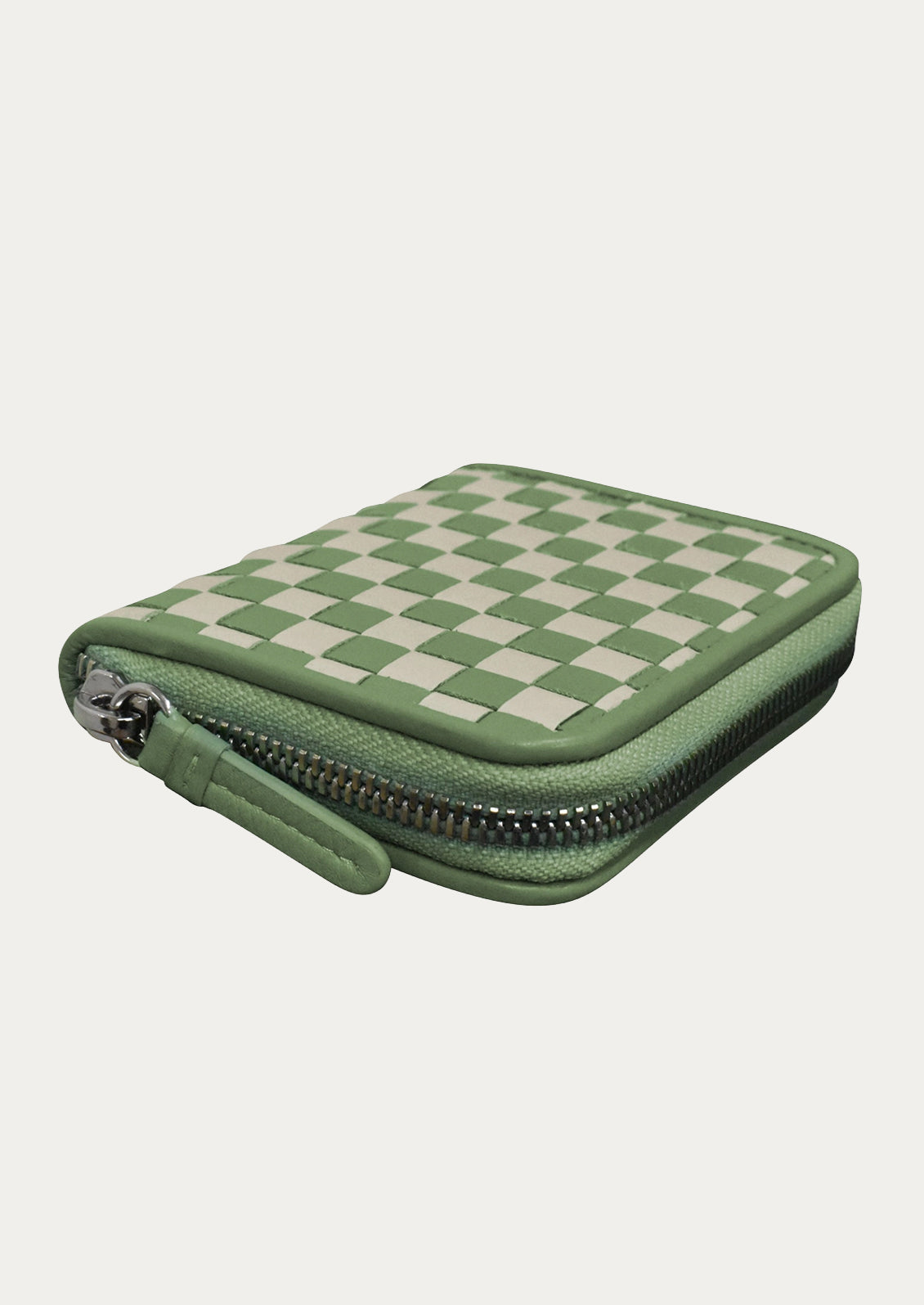 A leather checkerboard wallet in sage and cream.