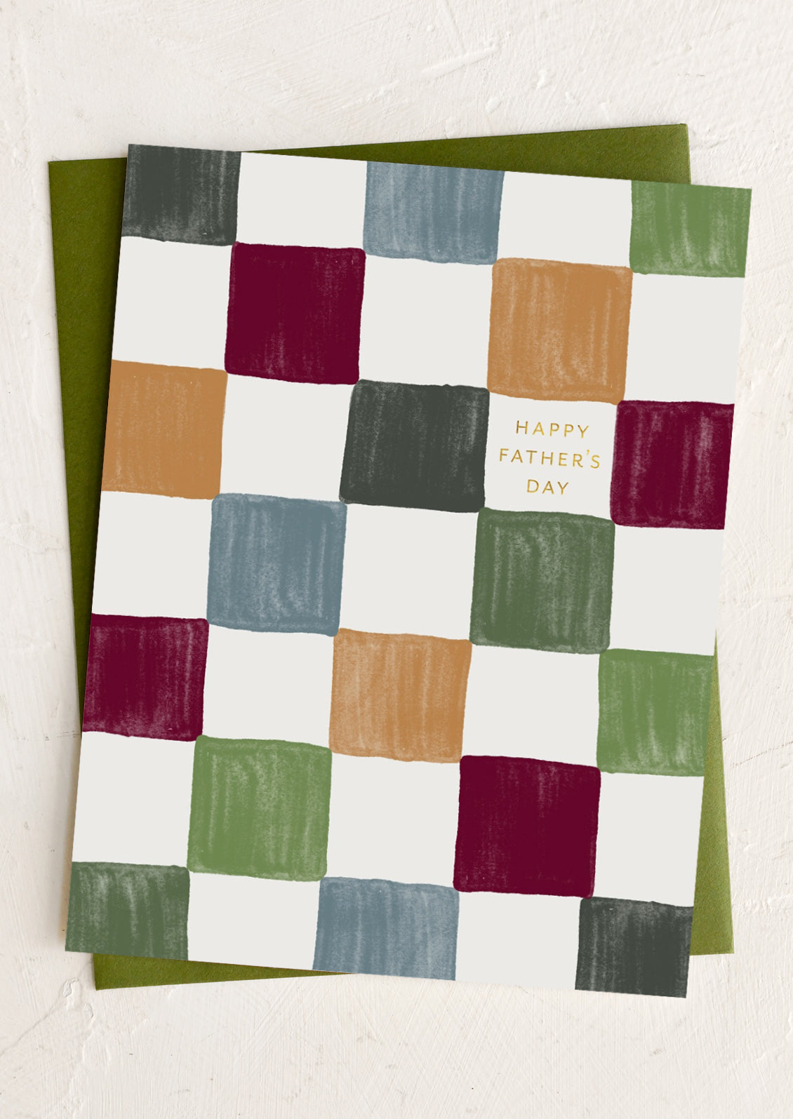 A checker print card reading "Happy father's day".