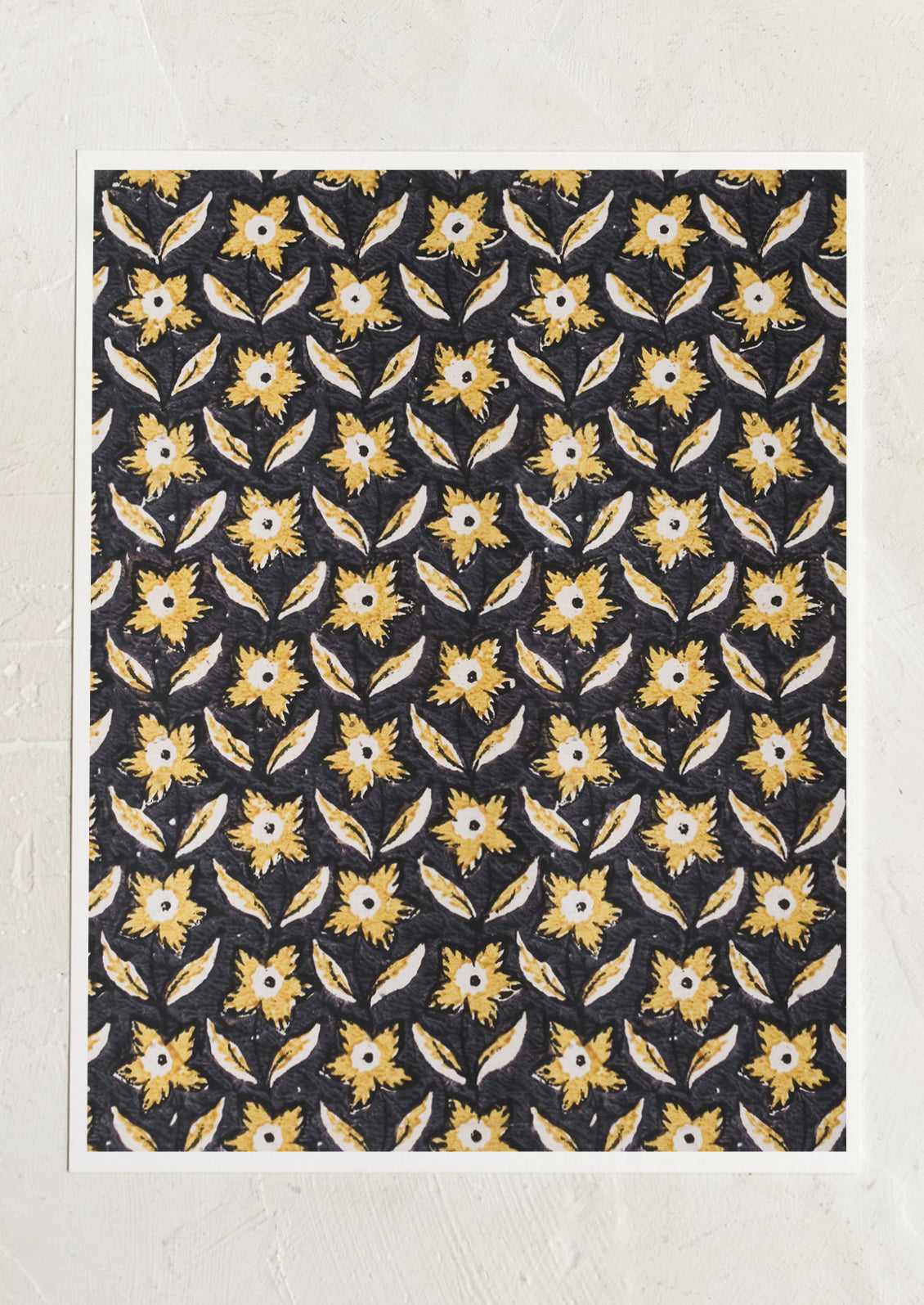 A block print textile inspired art print with black background and marigold colored flowers.