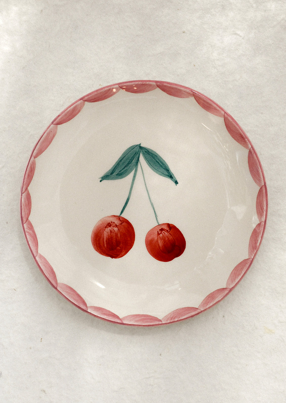 Small ceramic dish with cherry design.