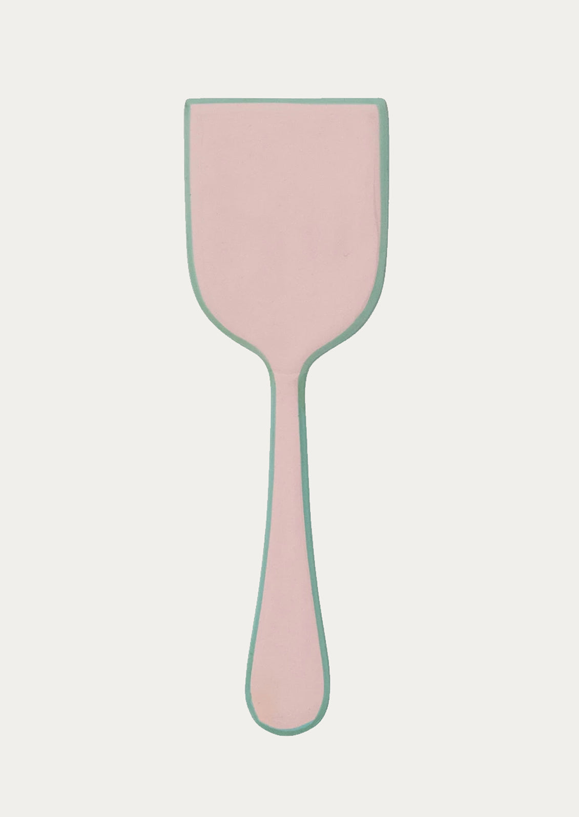 A chisel shaped cheese knife in pink with aqua edging.