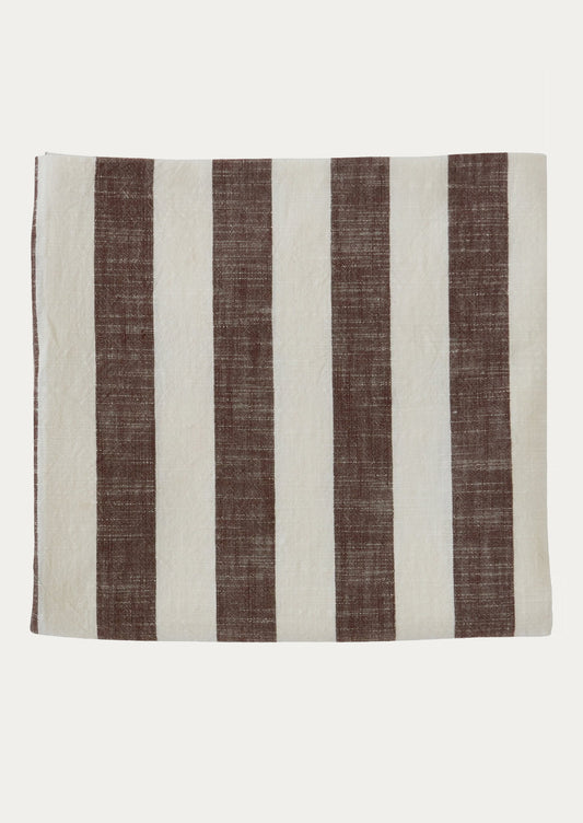A cotton tablecloth in brown and white stripe pattern.
