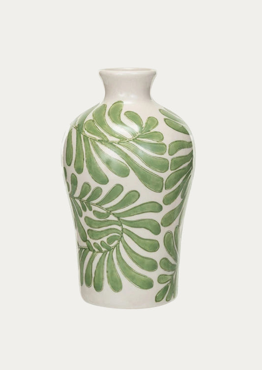 A vase in white with green seaweed/leaf pattern.