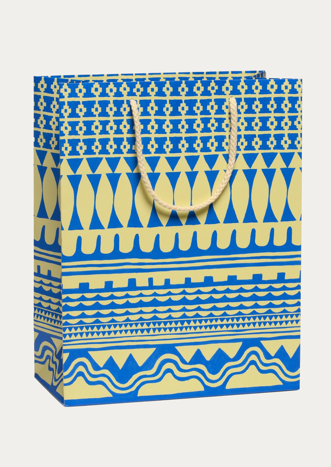 Patterned paper bag with blue and ivory design on a white background