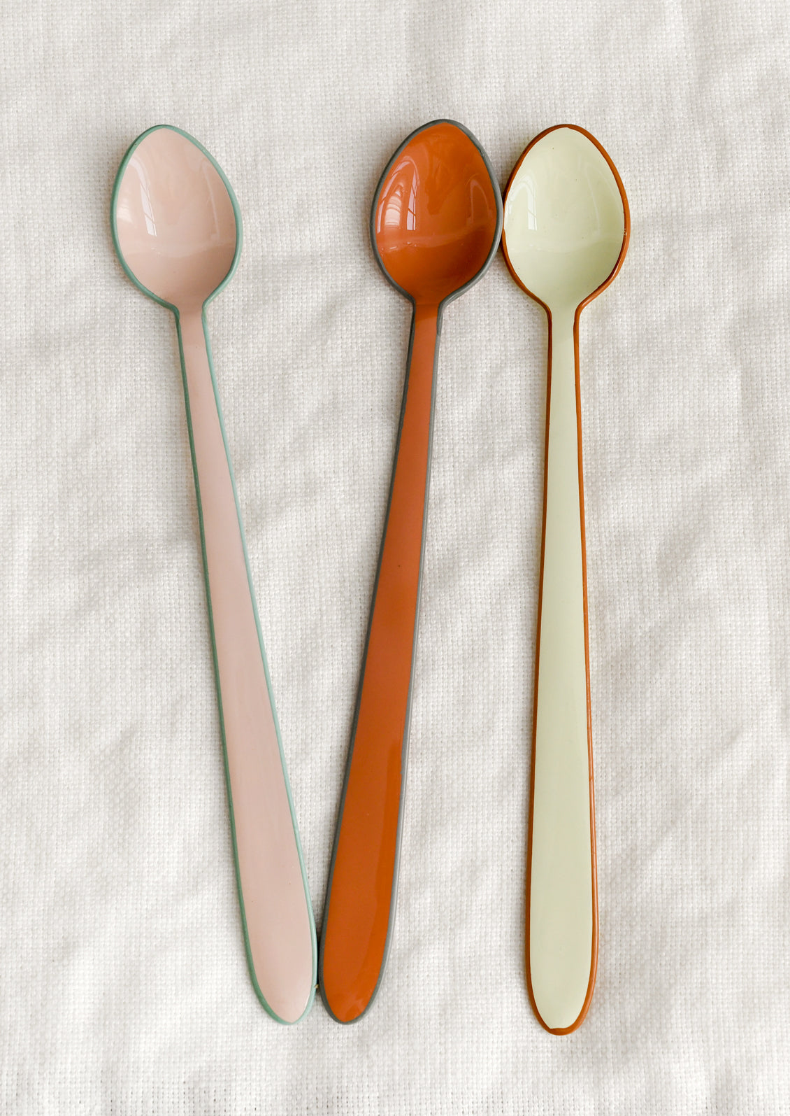 Enamel cocktail/tasting spoons in warm colors.