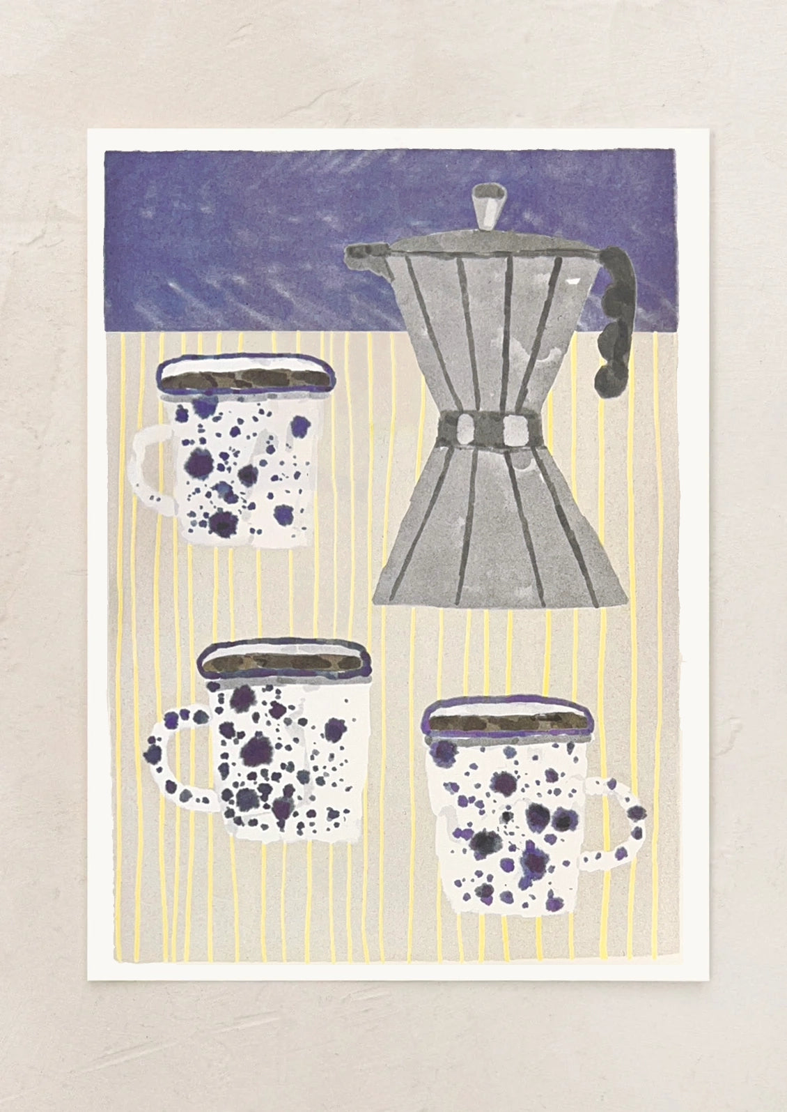 An art print featuring a stylized illustration of a gray moka pot and three white enamel mugs with dark purple speckles, set against a yellow-and-white striped background, mounted on a textured beige wall.