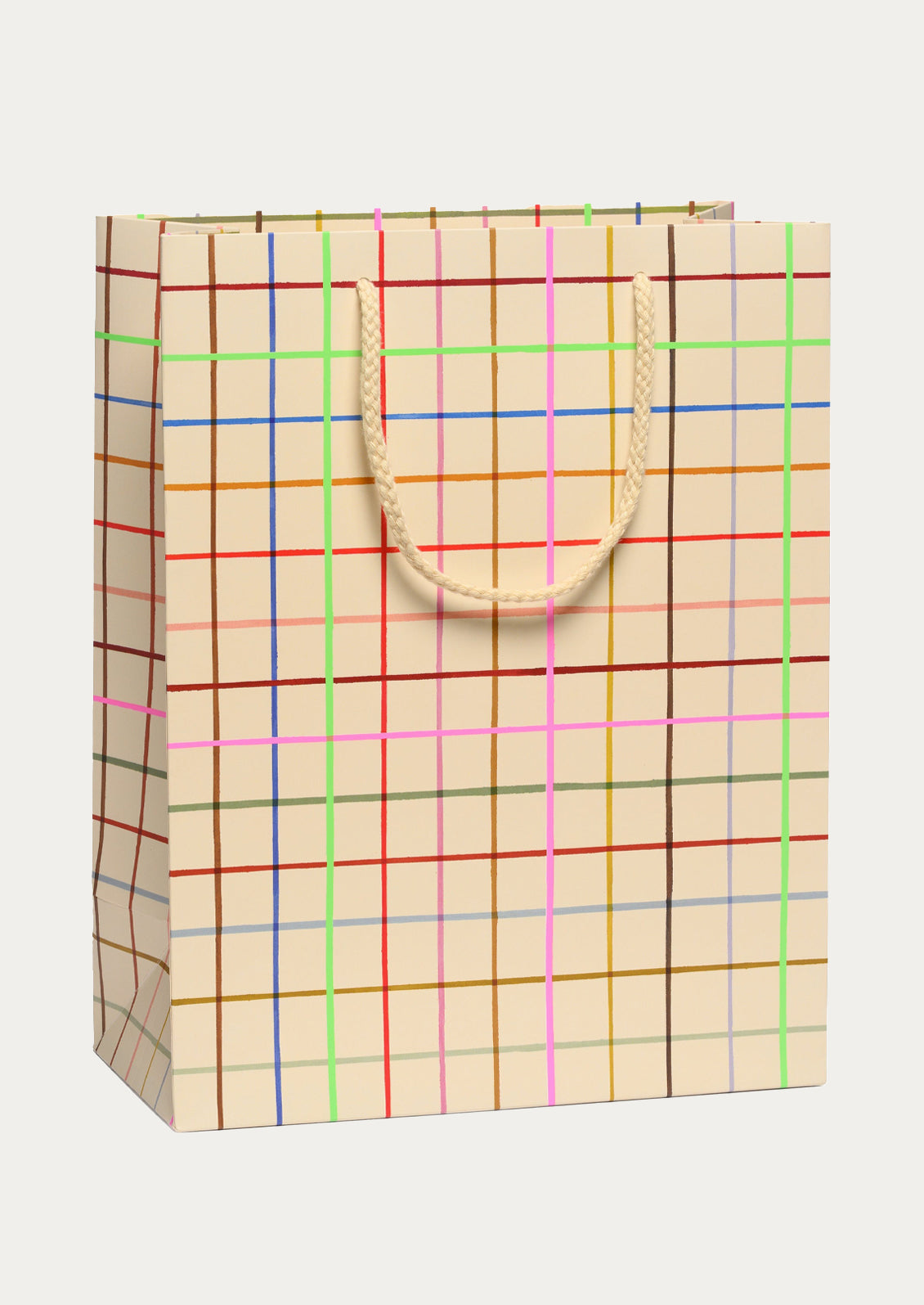 Beige paper bag with colorful grid pattern on a white background