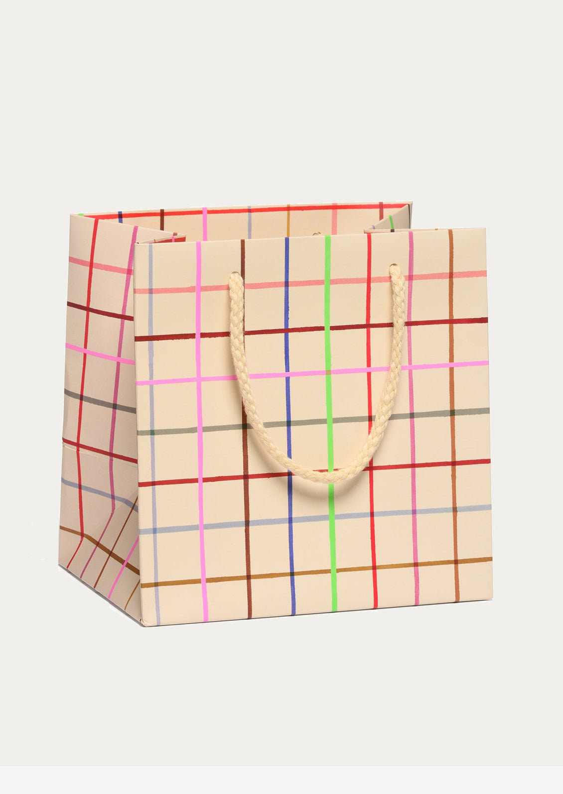 Patterned gift bag with multicolor grid pattern.