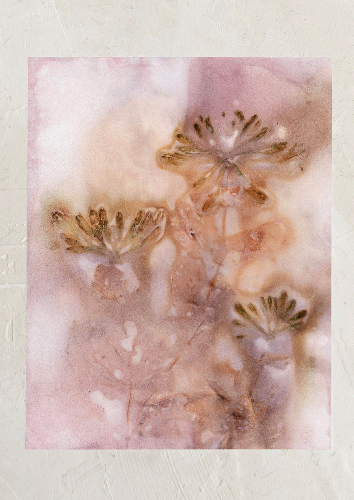 An abstract art print of blurry flower imprint in pink.
