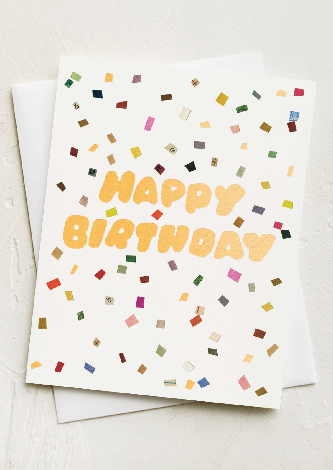 A card with image of confetti spray, text reads "Happy Birthday".