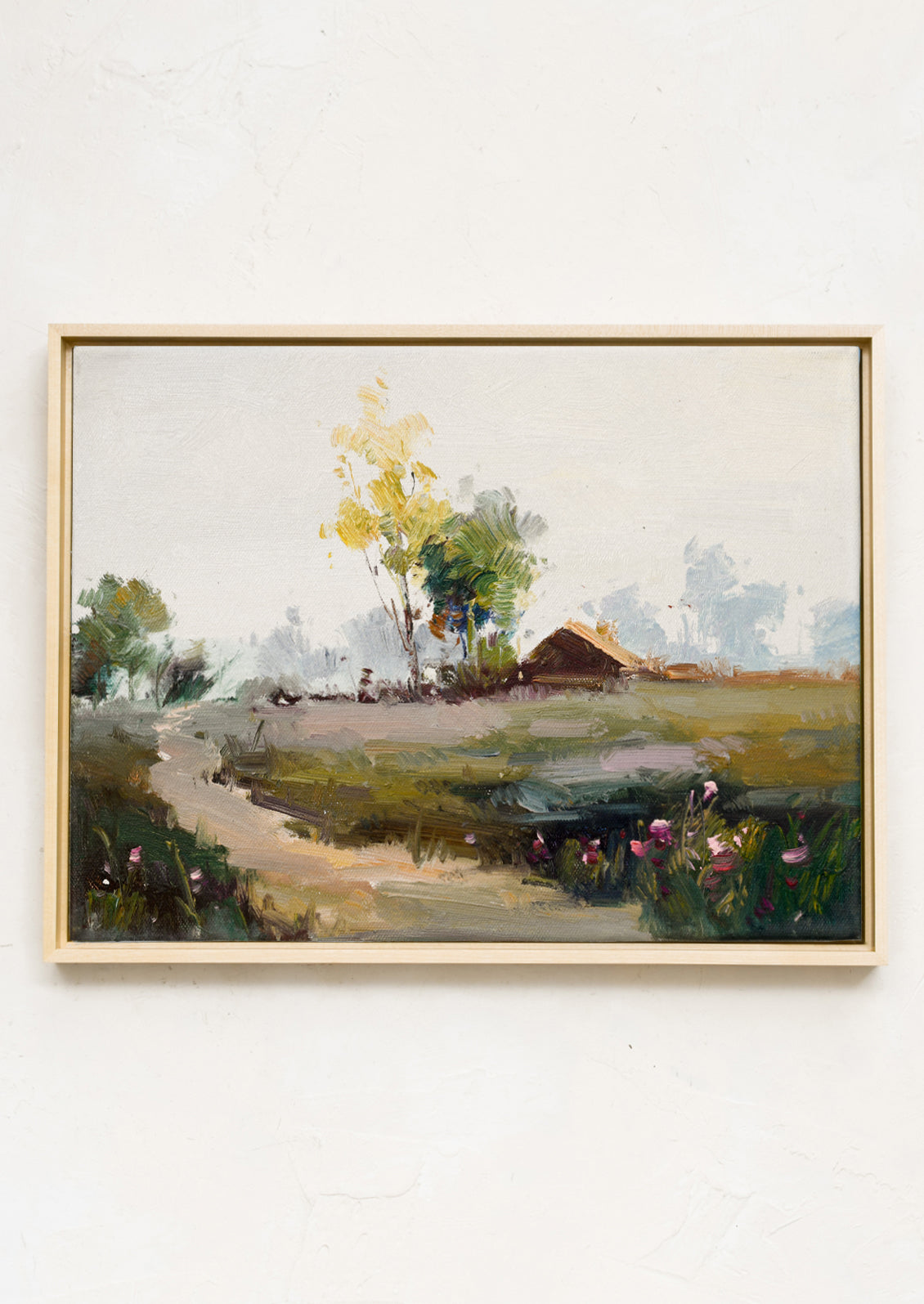 An original oil painting of a countryside scene with a structure in the distance.