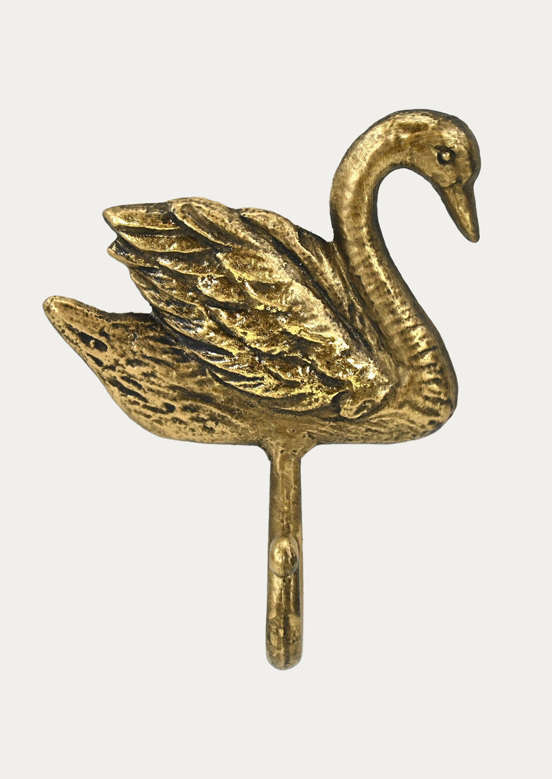 A handcrafted gold cast iron wall hook in the shape of a swan on a white background.