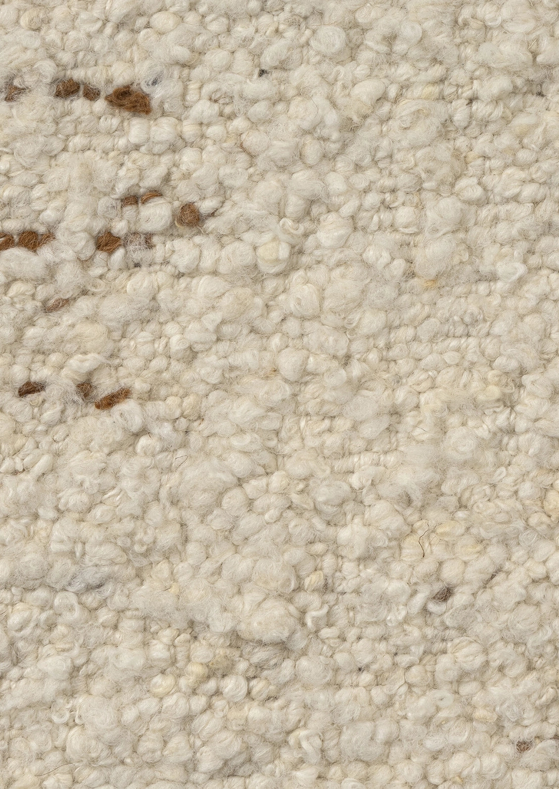 Close-up of a textured loop-pile wool fabric in cream.