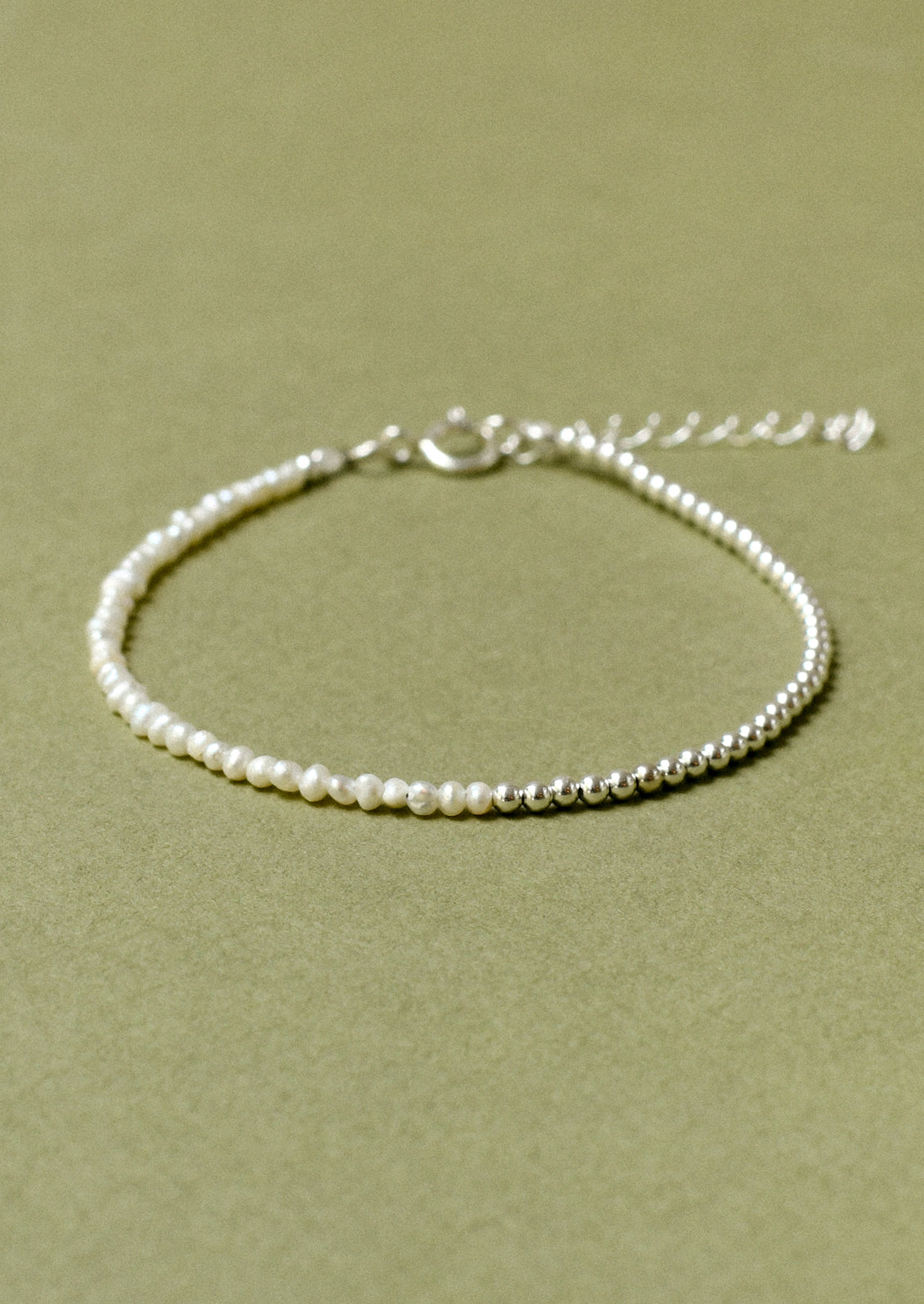 A bracelet with sterling silver beads and small freshwater pearls.