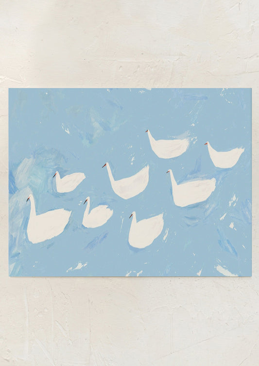An art print of an illustration of white swans on sky blue water.
