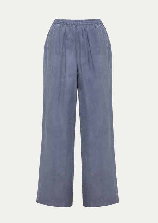 A pair of dusty blue pants with elasticized waistband.