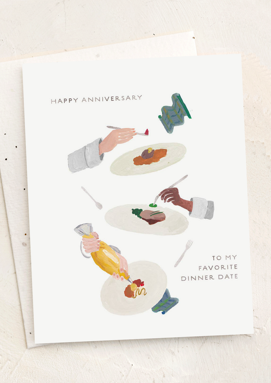 Greeting card with illustrations of hands serving food and text 'Happy Anniversary to my favorite dinner date' on a white background.