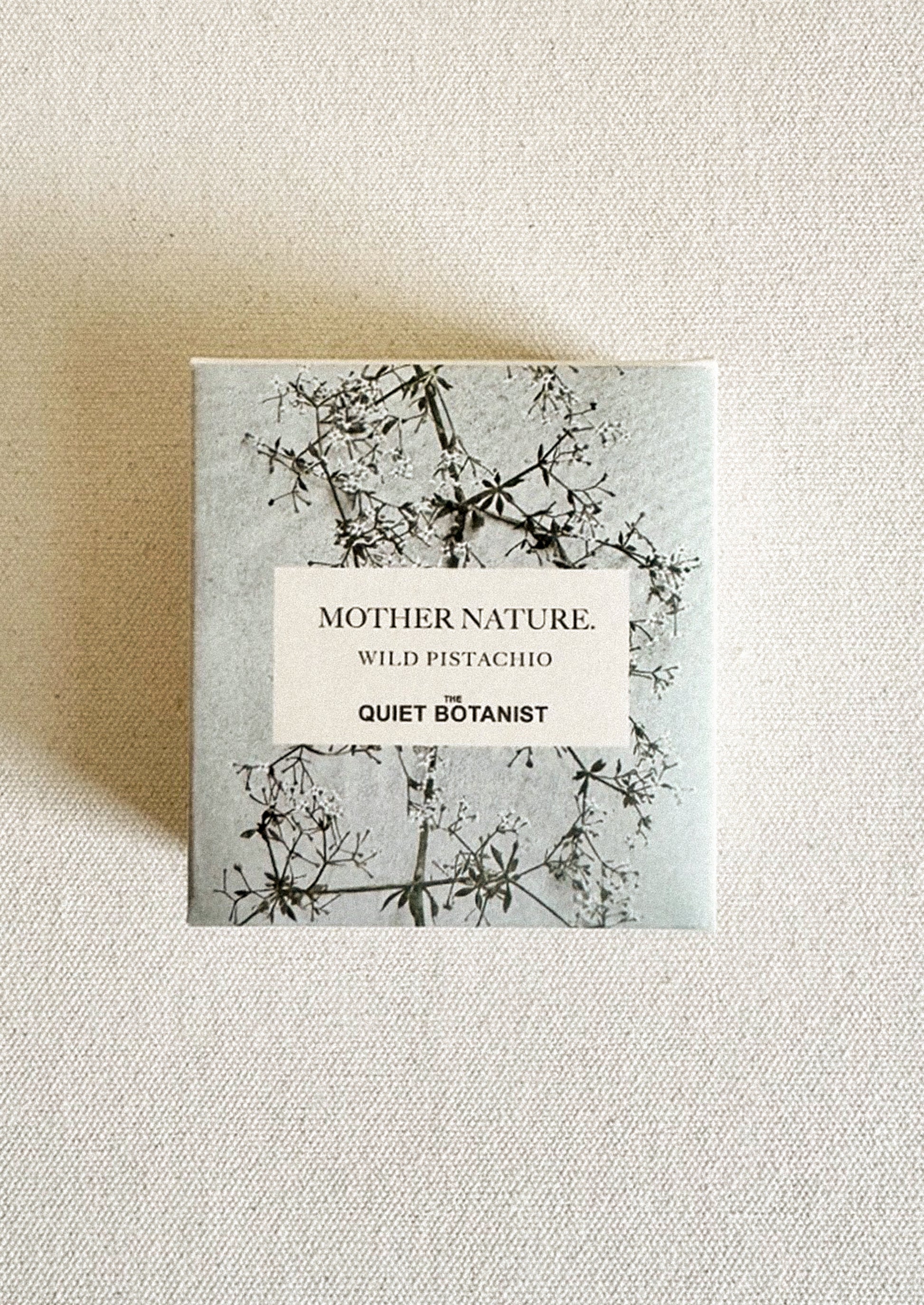 Product packaging with 'Mother Nature' and 'Quiet Botanist' text on a textured background