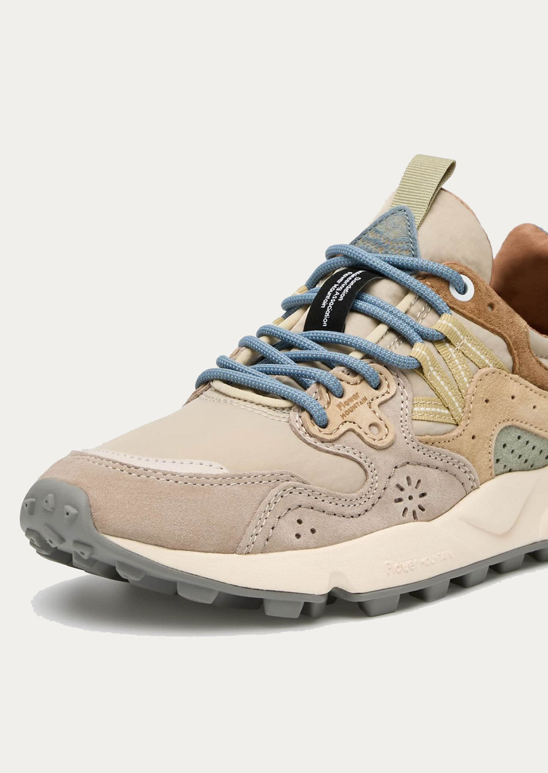 A pair of sporty sneakers in taupe/pastel multi color combo.