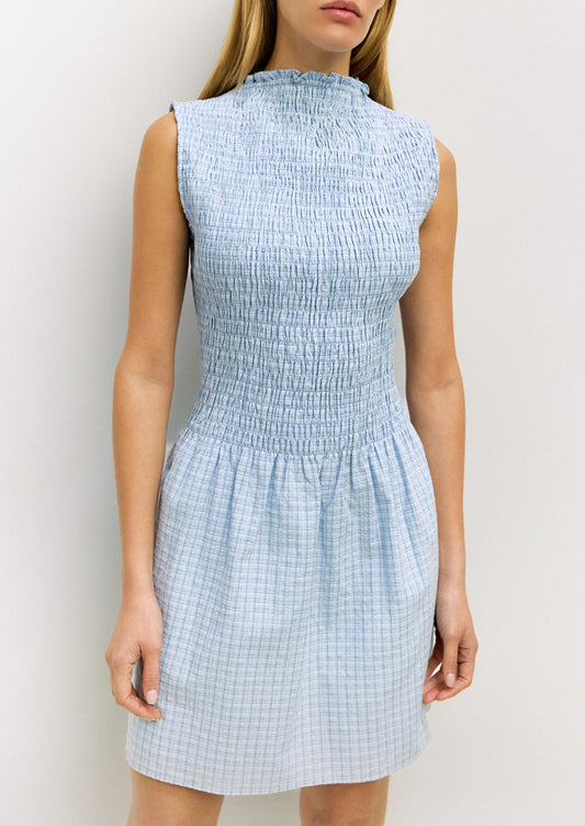 Light blue checkered dress worn by a model against a white background