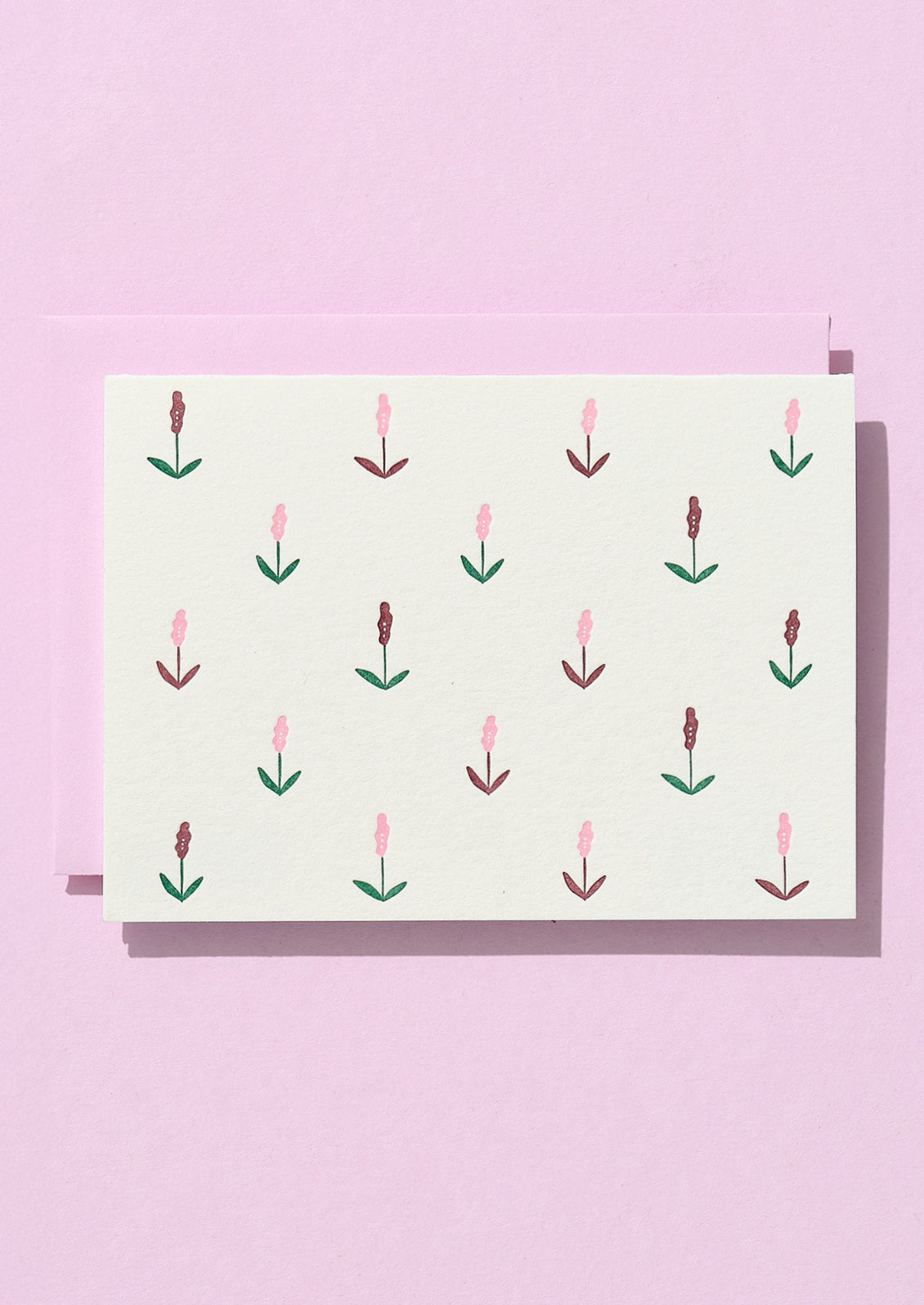 Greeting card with floral pattern on a pink background