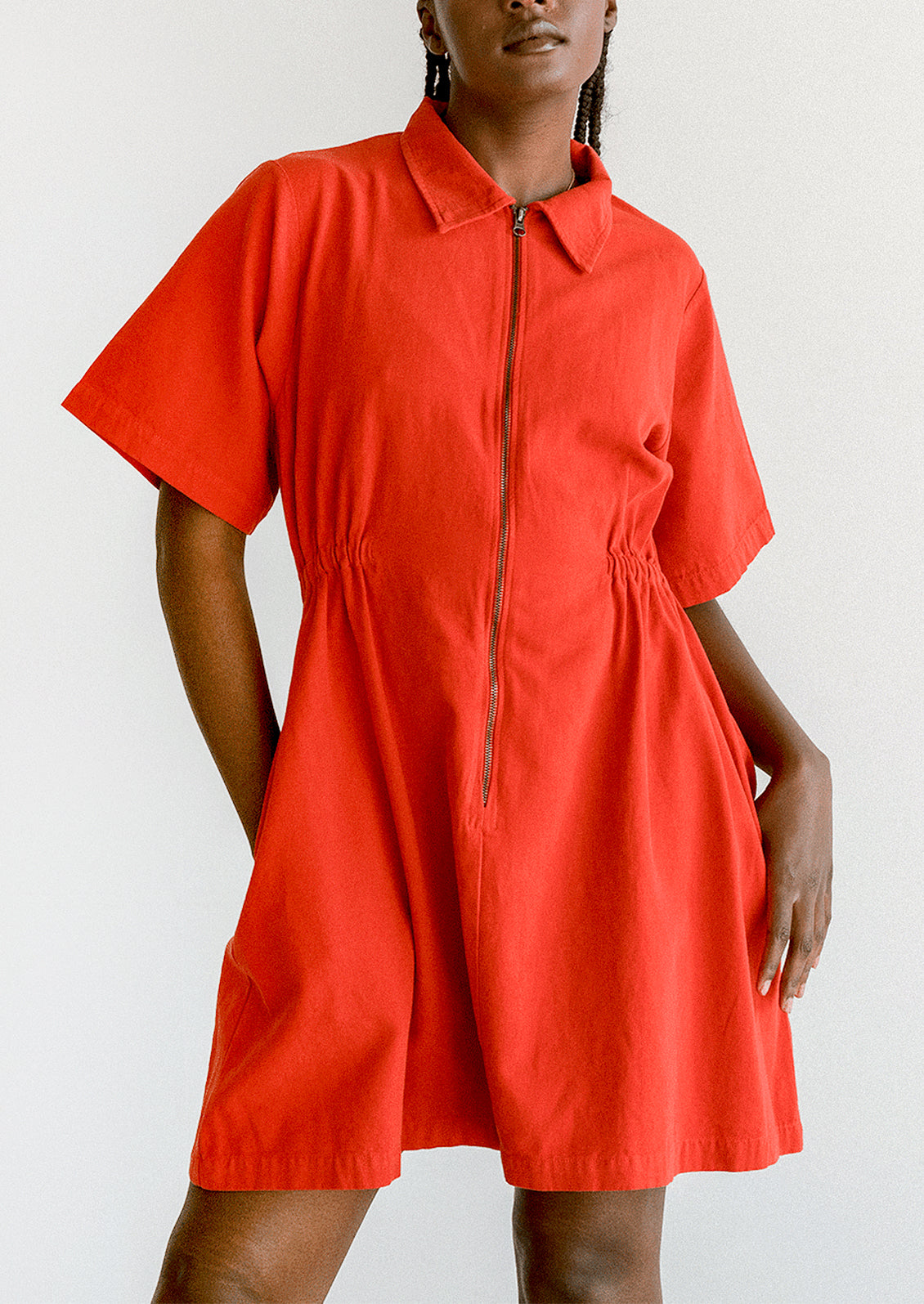 Red dress with a zipper on a white background