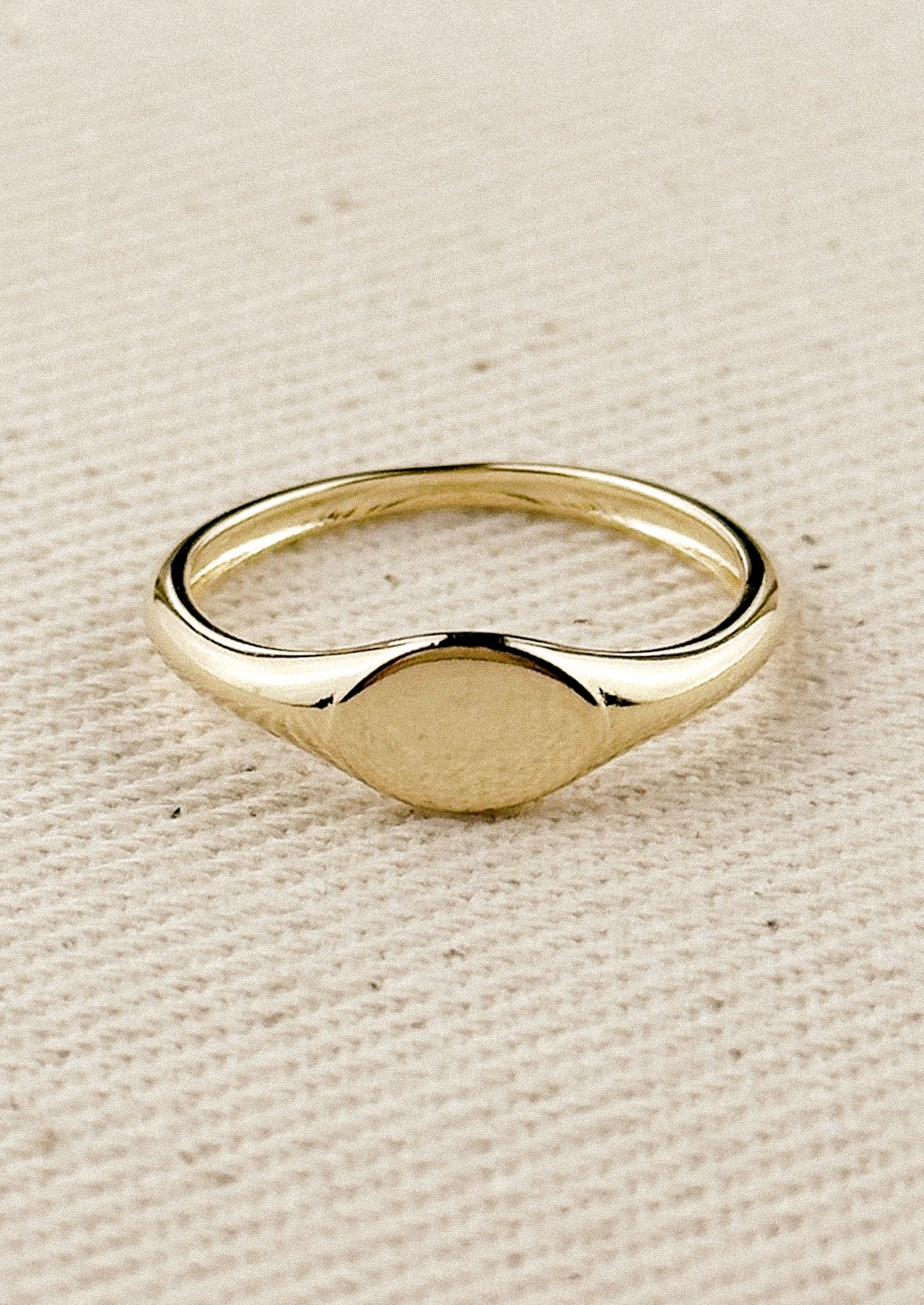 A simple signet ring in gold.