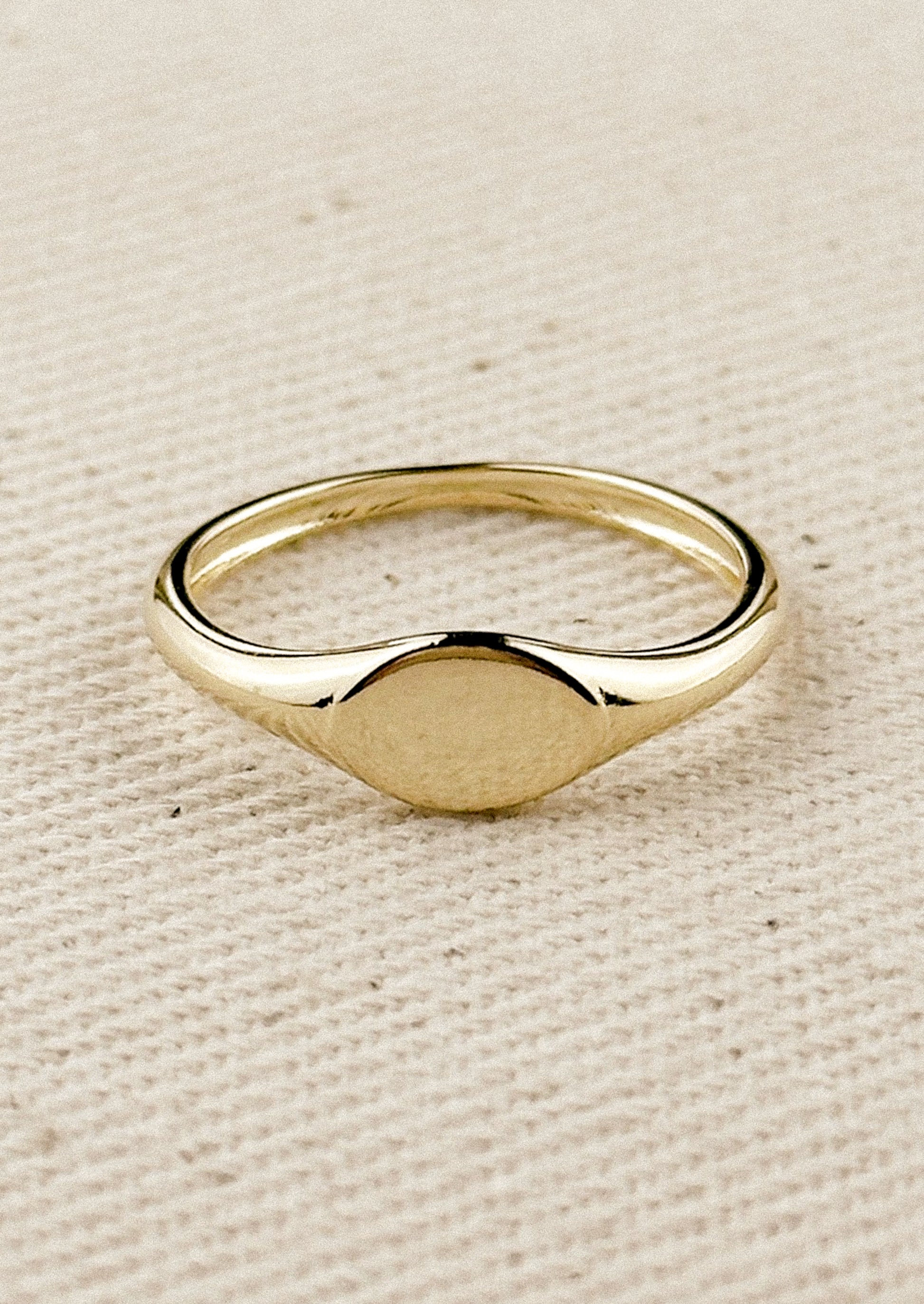 A simple signet ring in gold.