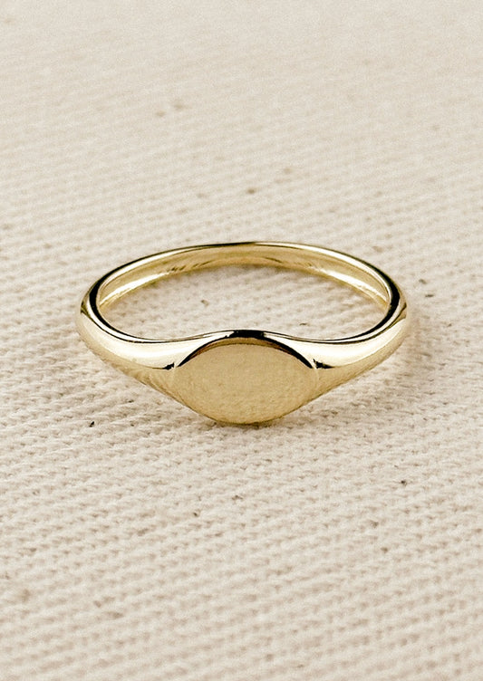 A simple signet ring in gold.