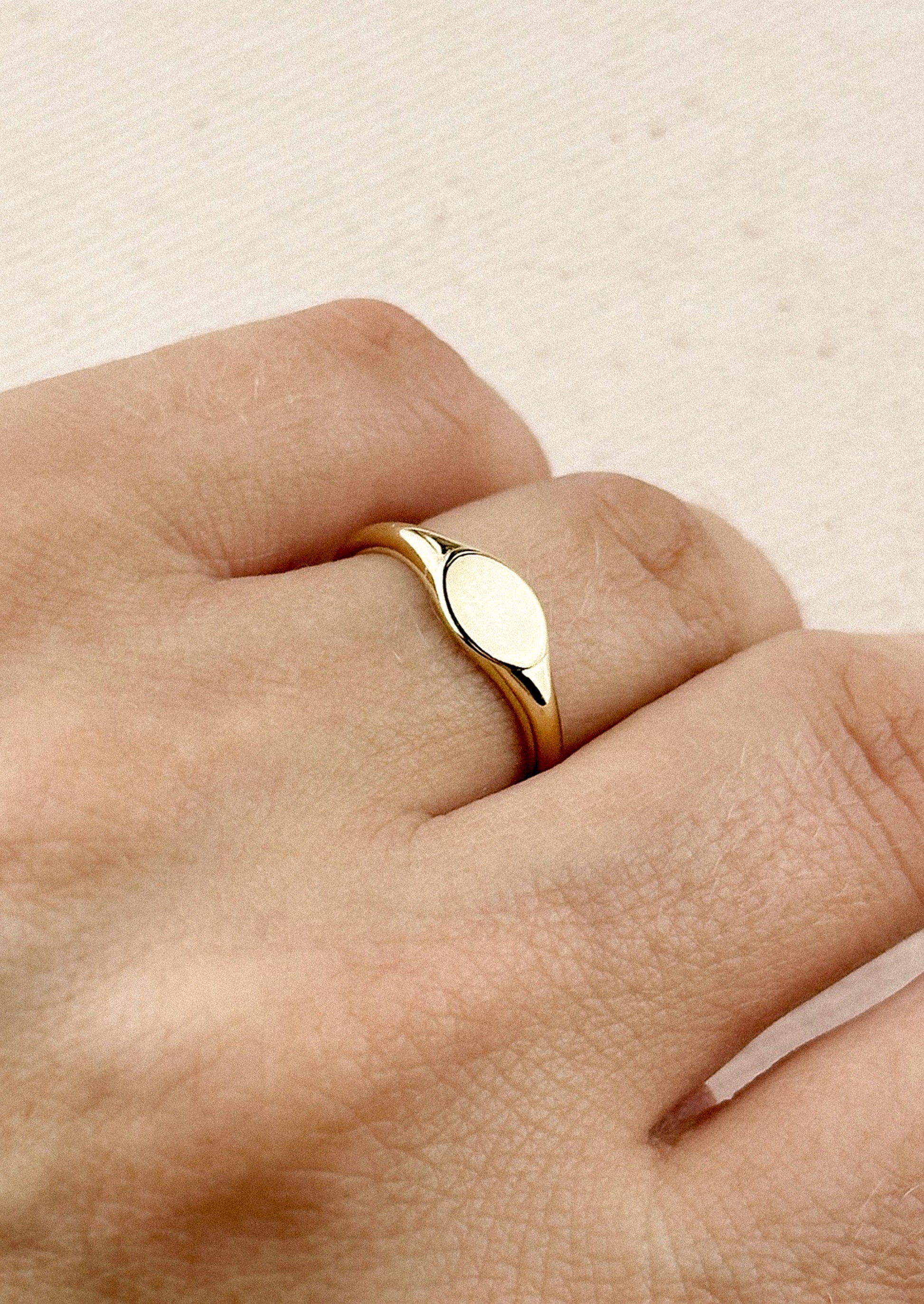 A simple signet ring in gold.