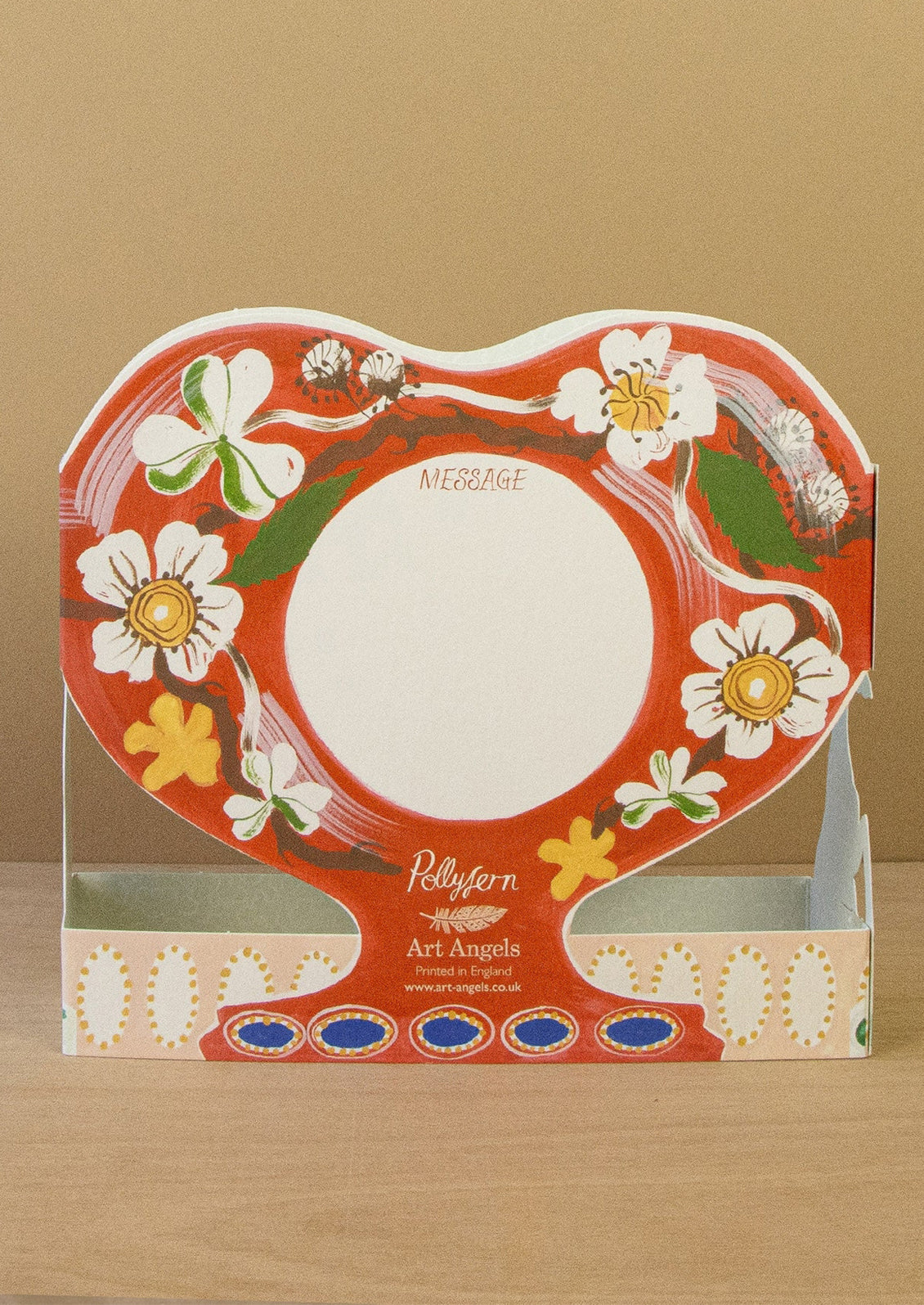 Decorative product packaging with floral design on a brown background