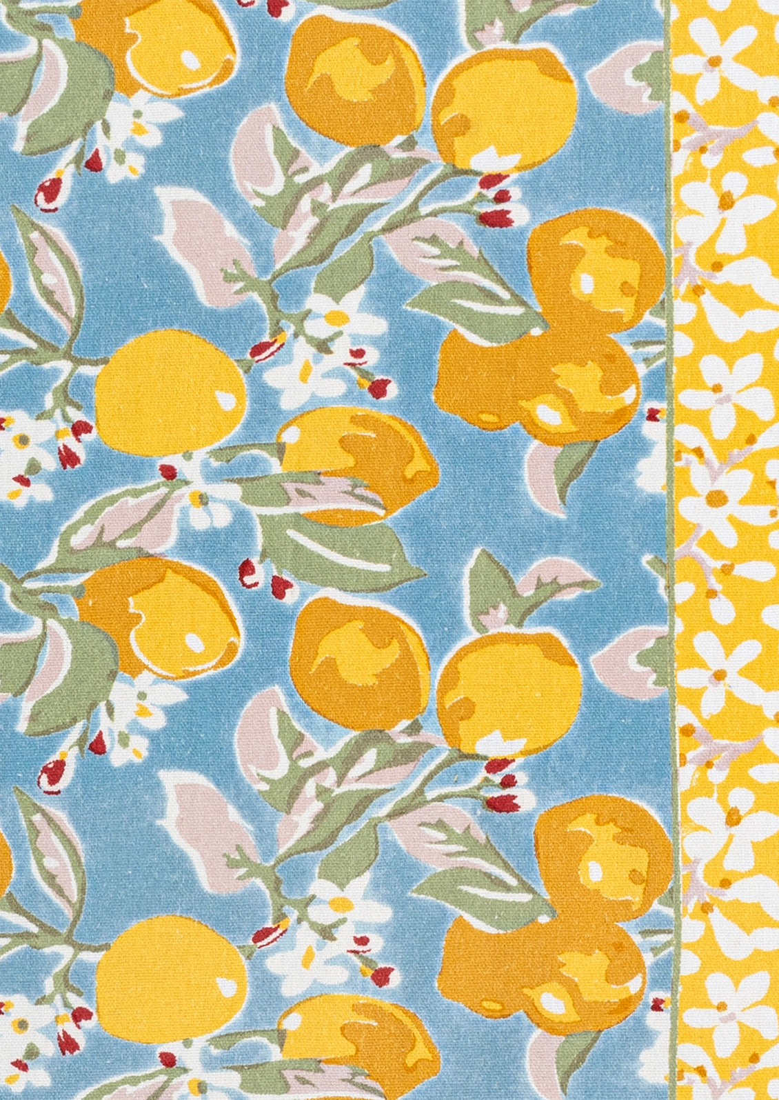 Patterned fabric with lemons and leaves on a blue background