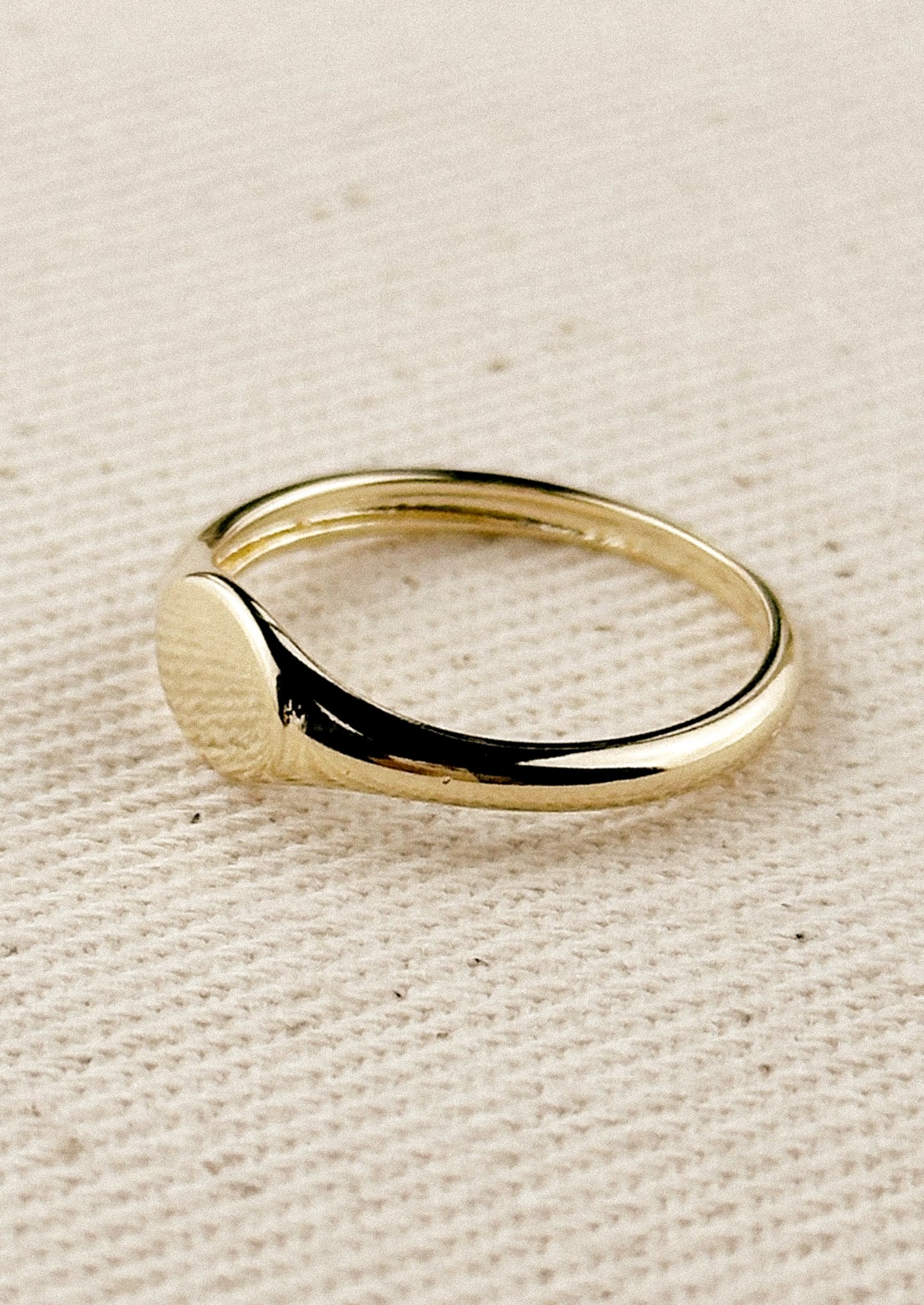 A simple signet ring in gold.