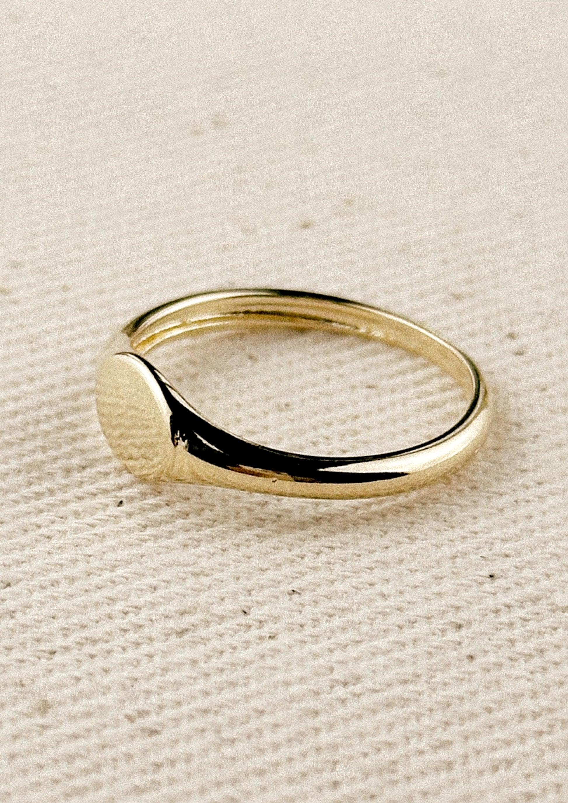 A simple signet ring in gold.