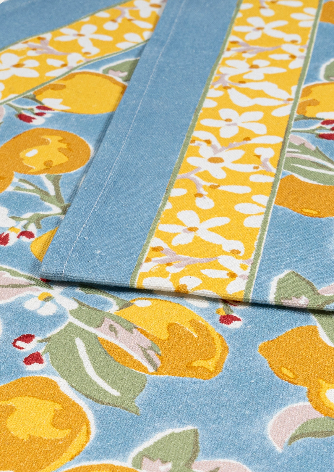Close-up of fabric with lemon pattern on a blue background