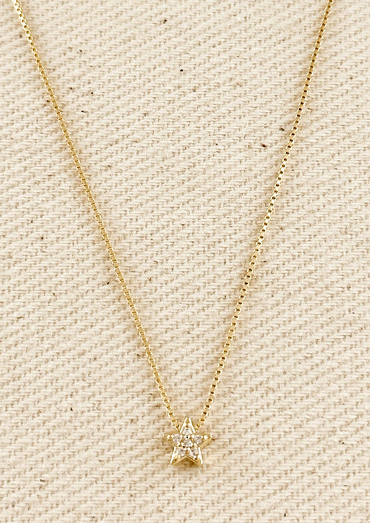 A gold box chain necklace with small gold & crystal star charm.
