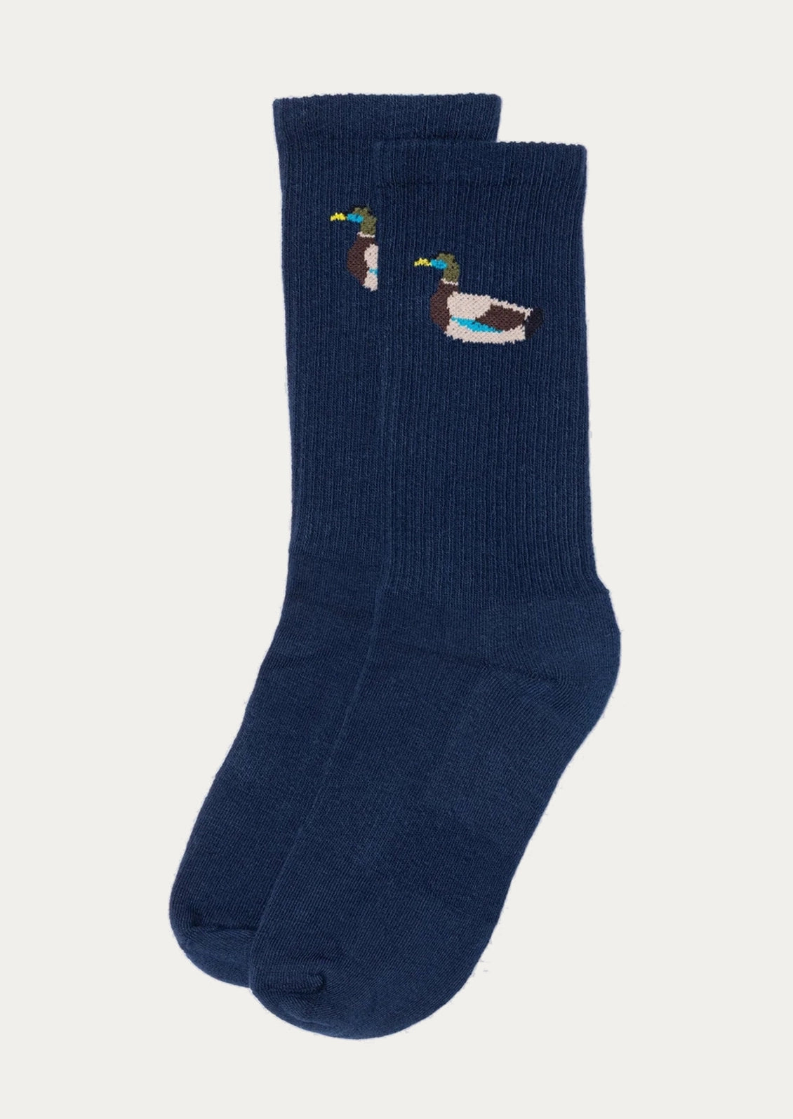 A pair of navy blue crew socks with embroidered duck motifs on the upper calf, displayed against a light off-white background.