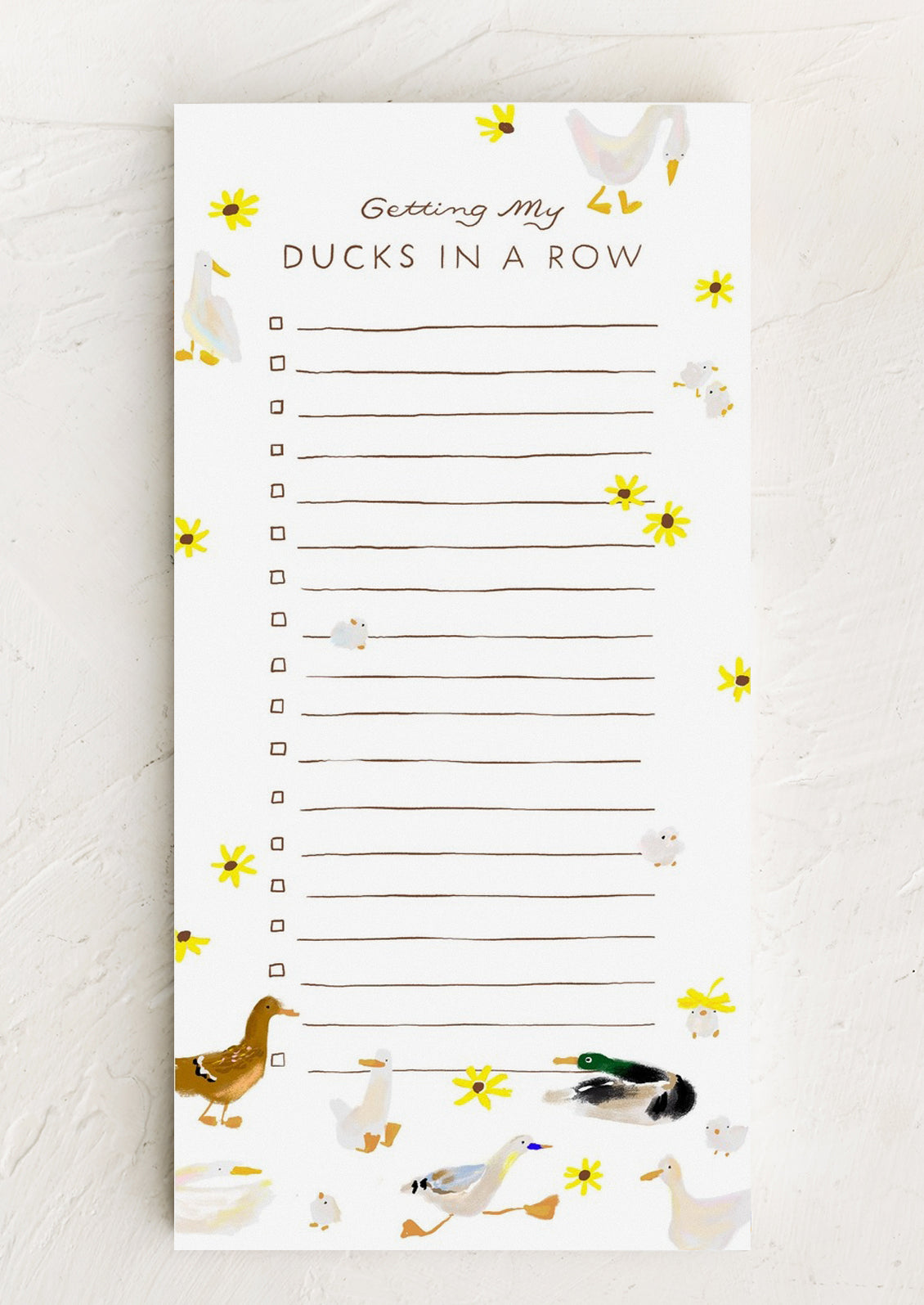 A long notepad with ruled lines and checkboxes, allover duck and flower print.