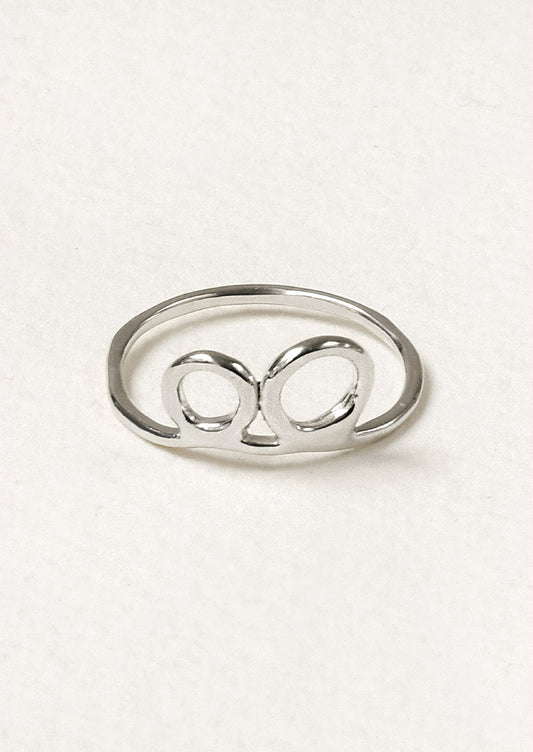 A sterling silver ring with a double circle design.