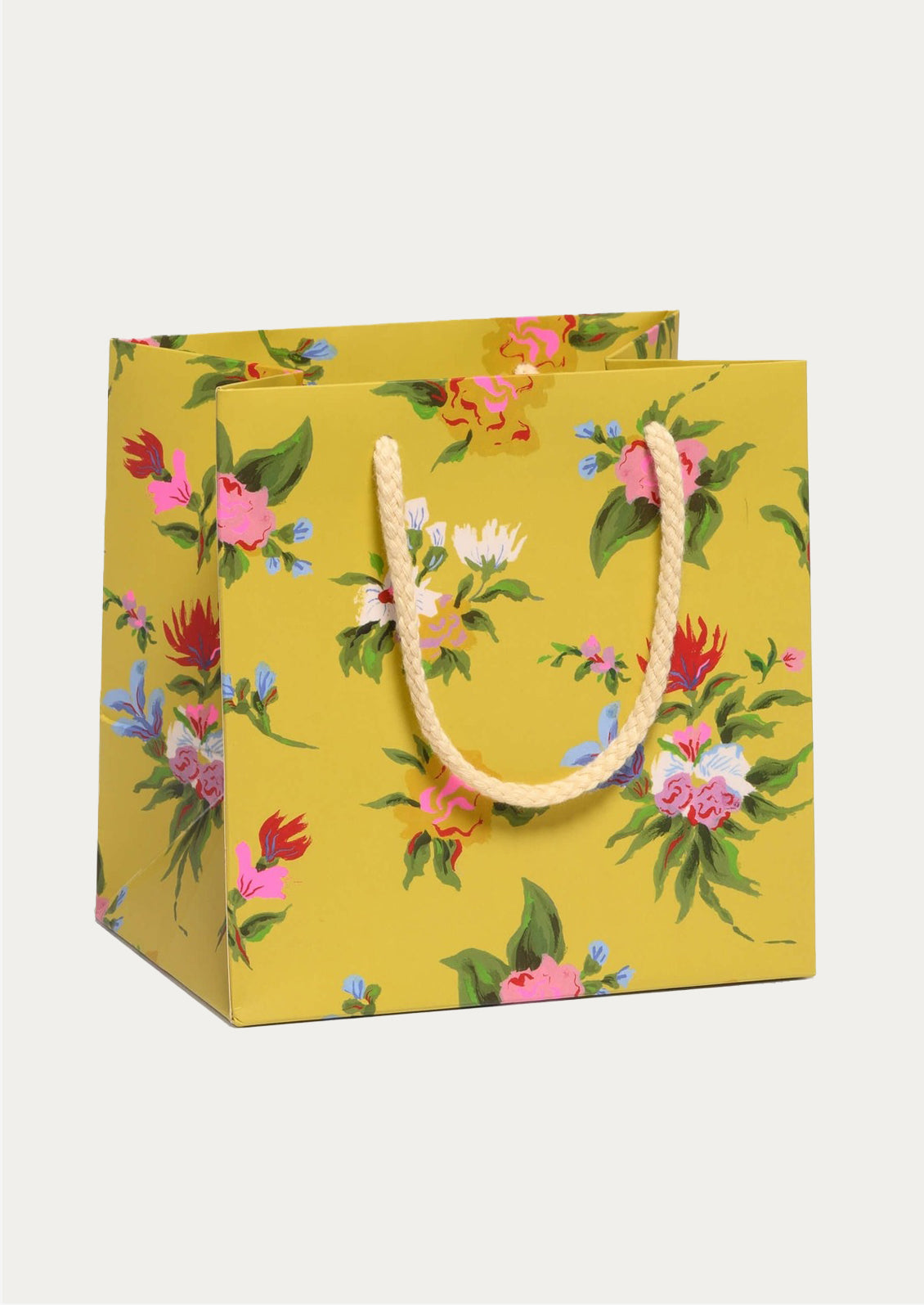 Floral-patterned gift bag with a yellow background