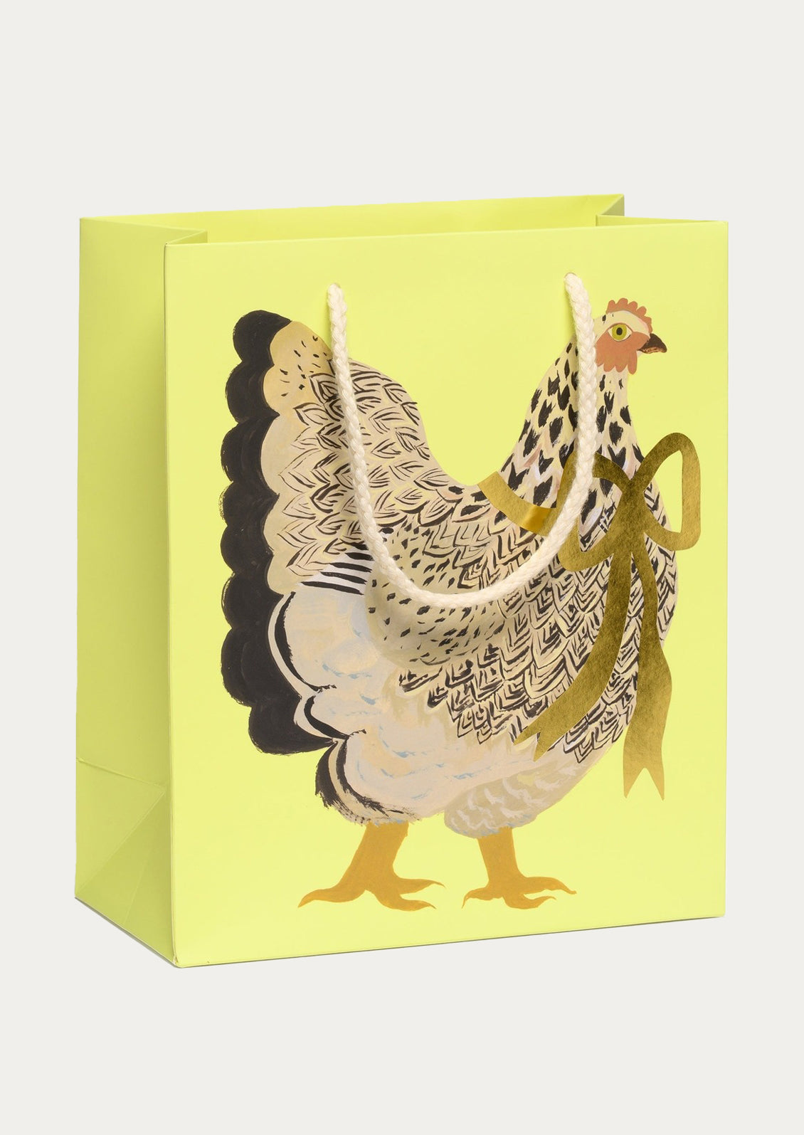 Gift bag with a rooster design on a yellow background